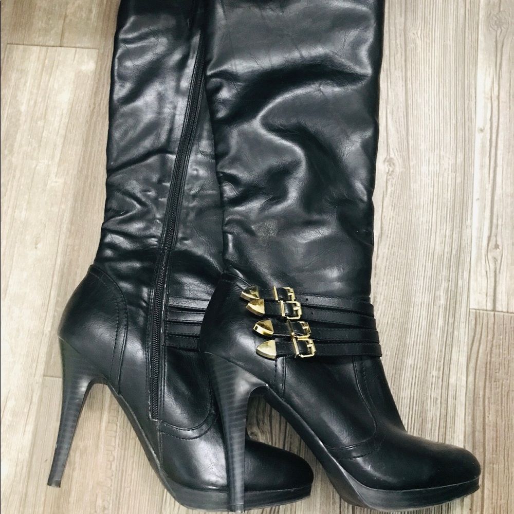 Women’s Black knee high, high heeled boots